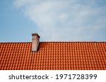 Red Tile Roof And Chimney...