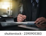 Small photo of Business person Writing contract law and paper work for business and finance, write document, complete job application forms, contract real estate and insurance concept.