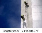 Two Industrial Climbers Roping...