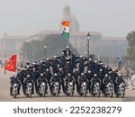 Small photo of New Delhi, Delhi, India, 01.21.2023 Republic Day India 2023 - Dare Devils Rehearsal - Indian military men showing their bike riding skills at motorbike rally - 34 men on bikes.