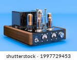 Vintage vacuum tube amplifier on blue background, 3D rendering 