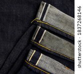 Small photo of A selvage or selvedge is a self-finished edge of a piece of fabric which keeps it from unraveling and fraying. Many colour and types of selvedge denim.