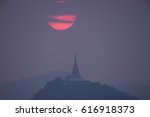 Sun setting behind pagoda