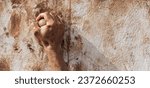 Small photo of Mud race runners, obstacles during extreme obstacle race. Detail of a hand overcoming an obstacle