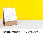 January calendar 2023 on the wooden table on a yellow background concept new year 2023