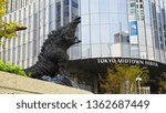 Small photo of CHIYODA, TOKYO, JAPAN - NOVEMBER 26, 2018: Godzilla statue near Tokyo Midtown Hibiya. This version of the famous kaiju monster appeared on the movie "Shin Godzilla", released in 2016.