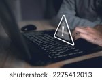 Small photo of Computer hack warning,System hacked warning alert on notebook (Laptop),cyber security concept,The danger of malware viruses,ransomware virus,triangle caution warning sign for notification error