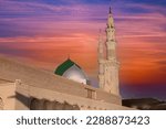Small photo of A mosque with a green dome and a cloudy sky. Masjid nabi of Medina. Green dome
