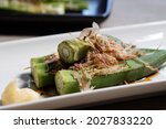 Boiled Okra Served On A White...