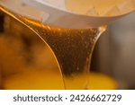 Small photo of Process of transfusion of fresh golden honey