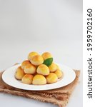 Small photo of Nastar Cookies, Pineapple tarts or nanas tart are small, bite-size pastries filled or topped with pineapple jam, commonly found when Hari Raya or Eid Al Fitr or Lebaran. Selective focus.