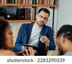 Small photo of Portrait of wife and husband during marriage therapy with counselor, marriage counselor supporting conflicted couple