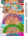 Small photo of ITALY, SICILY, PALERMO - 30 JULY 2021: Souvenir shop in via Maqueda, famous street in old city centre of Palermo, Sicily, Italy. Shopping beautiful flower-painted spanish wooden fan in Palermo.