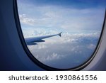 The blue, clear sky and beautiful clouds with the wings of the airplane that can see outside the window. High resolution photo editing source bookcover design for synthetic sources