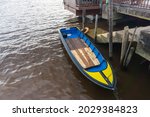 Rowboat Canoe Moored At Dock