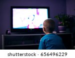 Boy Watching Television In Dark ...