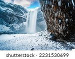 Majestic nature of winter Iceland. Impressively View on Skogafoss Waterfal. Skogafoss the most famous place of Iceland