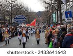 Small photo of Mainz, Germany - February 10, 2024: Traditionally, every year at 14.11 at the carnival season is opened in Mainz by shouting 3x "Helau" and celebrating on the streets with kids, Der Jugendmaskenzug.