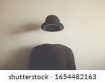 invisible man wearing black bowler, surreal concept of absence of identity