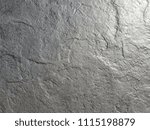 Small photo of Unwrought rough surface of gray granite stone