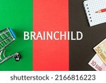 Small photo of BRAINCHILD - word (text) and euro money on a table of different colors, a trolley, a basket of grocery notepad and a red pencil. Business concept, buying, selling, supermarket, store (copy space).