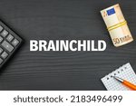 Small photo of BRAINCHILD - word (text) and euro money on a wooden background, calculator, pen and notepad. Business concept (copy space).