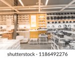 Small photo of Blurred abstract variety of cookshop and tableware at furniture retailer in Texas, USA. Defocused wide selection of kitchen, dining cookware utensils. Hand-held tools, gadget home necessities