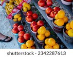 Small photo of Navel orange, honeybell oranges, tomatoes, mangos carton boxes on shelves display roadside market stand in Santa Rosa, Destin, Florid, homegrown fruits summer harvest stall. Organic food local grow