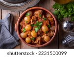 Small photo of Traditional Greek dish of beef stifado in a sauce. Meat stew, onion stew. Turkish name; sogan yahni or et yahni