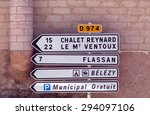 Small photo of bedoin,france-june 28, 2015: road sign to the mont ventoux and chalet reynard in the village of bedoin