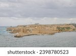 Small photo of Panoramic view of Fort Ricasoli, Grand Horbour of Valletta, Saint Elmo Breakwater and Ricasoli East Breakwater from Saint Angelo fort viewpoint. Fort Rikasoli. Kalkara. Malta.