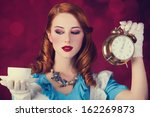 Portrait of a young redhead woman dressed as Alice in Wonderland, video game.