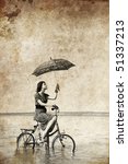 Girl With Umbrella On Bike....