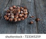 Small photo of Hazelnuts in openwork plate on teriann background rustic