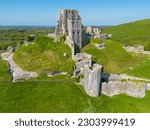 Small photo of Corfe Castle, Dorset, United Kingdom. 05.13.2023 Lovely Spring time Aerial Image of 11th Century built Corfe Castle. 13th May 2023.