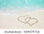 Two Hearts Handwritten On Sand...