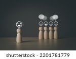 Small photo of The wooden figure, isolated from the crowd, seemed happy from being chosen over confusion and conflict with others. Leadership concept, dissent, rejection, doubt. Wooden peg doll, wooden puppet.