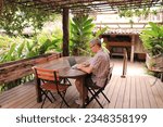 Man working from hotel at the beach. Concept for digital nomad, work from anywhere, work and travel.