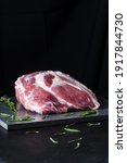 Small photo of Unready pork neck on black background copy space