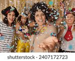Hippie woman welcomes guests to the Carnival party in Brazil. Dressed group of brazilian friends enjoying Carnival Party and throwing confetti.