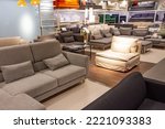 Showroom in the upholstered furniture store department with sofas