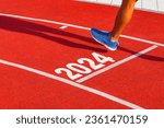 Small photo of Runner crosses the finish line on a red treadmill with the numbers 2024. New year entry concept, step