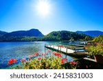 Landscape at Lake Altaussee in the Salzkammergut in Austria. Idyllic nature by the lake in Styria. Altaussee at Totes Gebirge with a view of the surrounding mountains.	