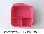 Small photo of Terengganu, Malaysia - JANUARY 5 2021 . Top view of Tupperware lunch box with a white background along with a blank for writing. Tupperware product is an American brand. Keep dry. Plastic container.