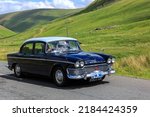 Small photo of Birkhill, Scotland - JUNE 25, 2022: 1962 Blue Humber Super Snipe saloon car in a classic car rally en route towards the town of Moffat, Dumfries and Galloway