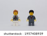 Small photo of tangsel, indonesia- april 9, 2021:photo of two office guys wear formal suit in isolated white background. lego minifigs are made by the lego group.