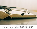 Stethoscope And Books On White...