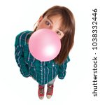 Small photo of Young Woman Blowing Bubble Gum Over White Background