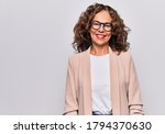 Small photo of Middle age beautiful businesswoman wearing glasses standing over isolated white background with a happy and cool smile on face. Lucky person.