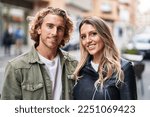 Man and woman couple smiling confident standing together at street